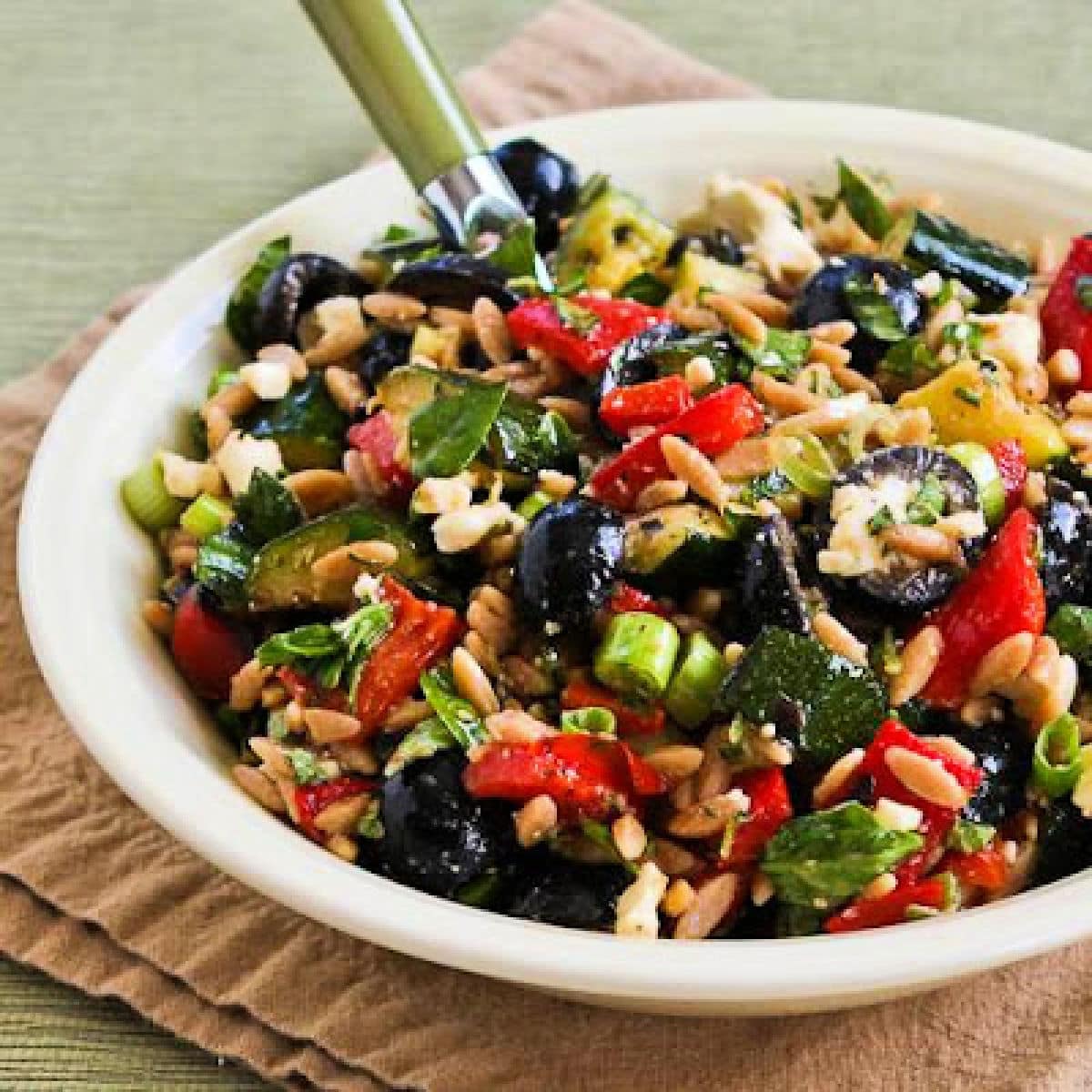 Grilled Vegetable Salad with Feta and Orzo shown in serving bowl.