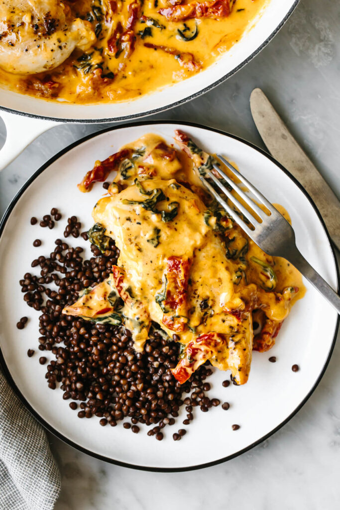 A plate of lentils and tuscan chicken