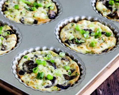 Square image for Mushroom Tarts with Feta shown in tart pan.